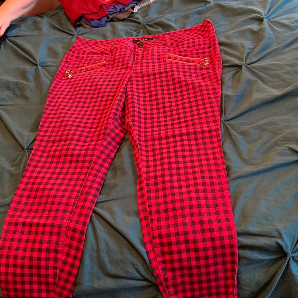 Red and black buffalo check skinny pants.